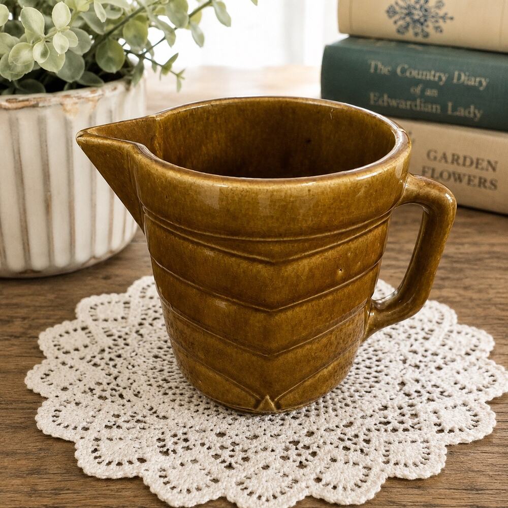 Vintage McCoy pottery pitcher with brown glaze &  embossed chevron wave pattern